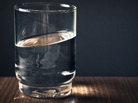 a glass of water that it halfway full