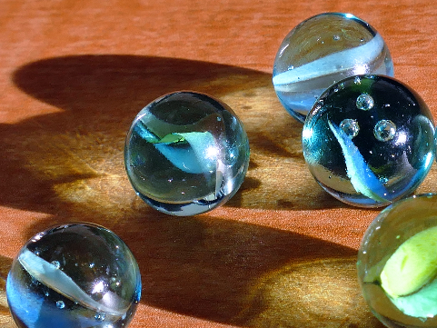 glass marbles resting on a table
