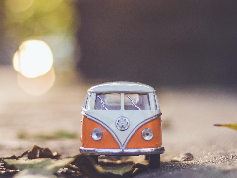 a toy VW van on a street